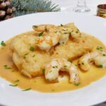 Bacalao al punto de sal con langostinos